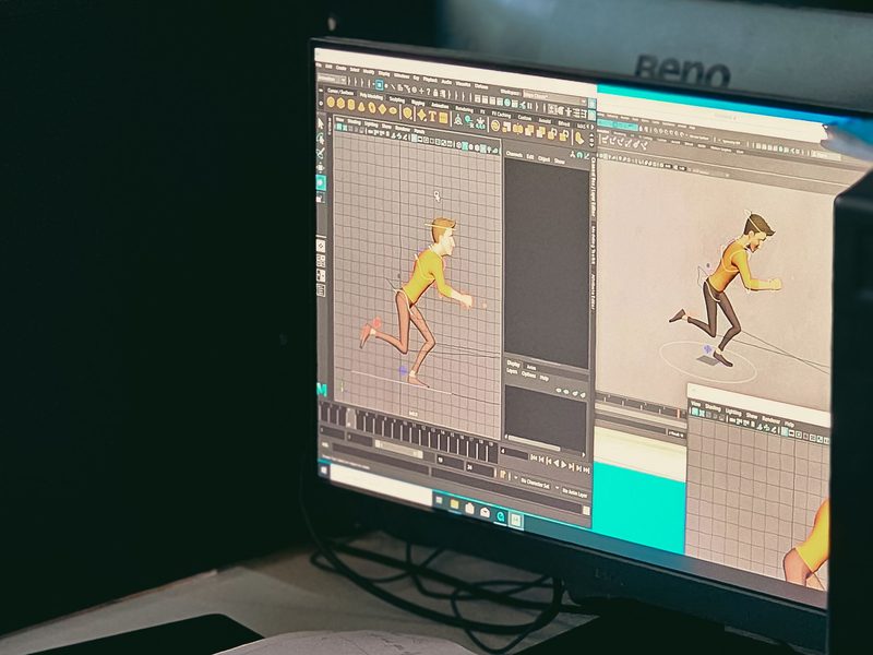 Studio monitor showing a running character being posed frame by frame in 3D animation software, timeline open below